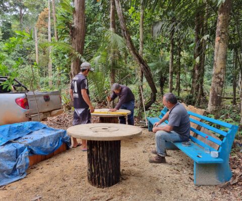 Some make-shift tables are set up to accommodate the large group of people. © CloudRoots Team